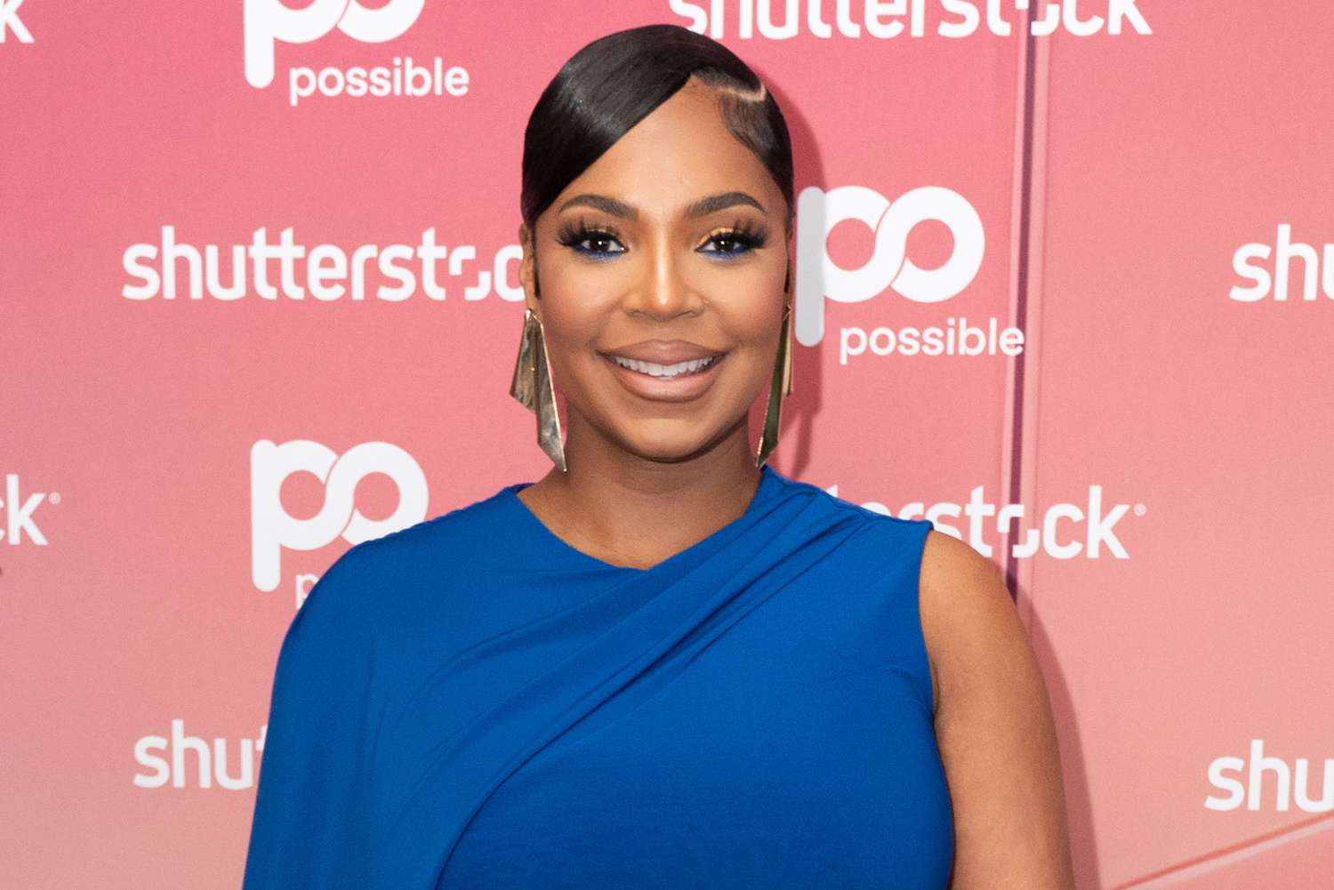Pregnant Ashanti Shows Off Baby Bump in Curve-Hugging Dress [Video]