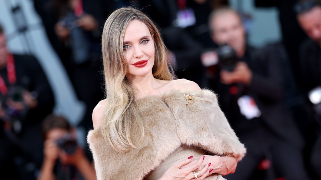 Angelina Jolie Looks Unrecognizable With Larger-Than-Life Disco Curls [Video]